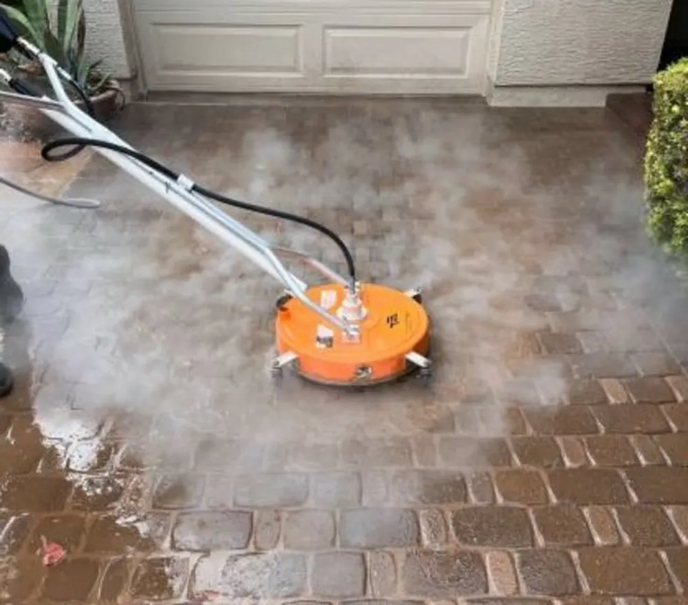 Surface cleaner washing grime off brick pavers