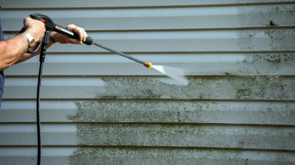 Pressure washer wand leaving a clean stripe on siding